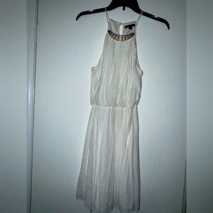 White Dress with High Neckline and Gold Detailing